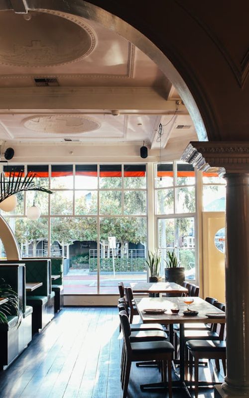 Interior on spacious classy restaurant with arches in daylight